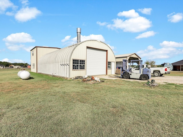 view of outdoor structure featuring a yard