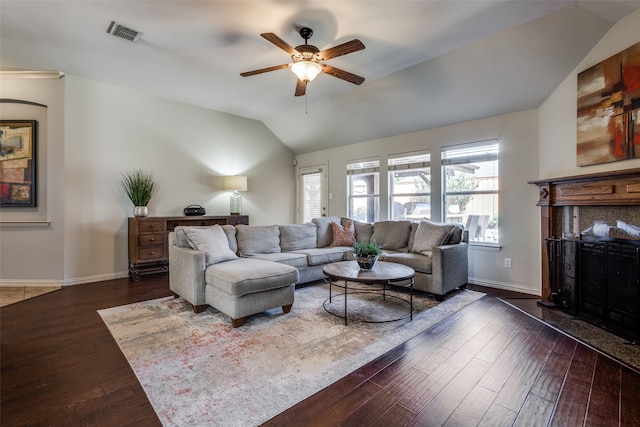 living room featuring lofted ceiling, ceiling fan, and dark hardwood / wood-style flooring