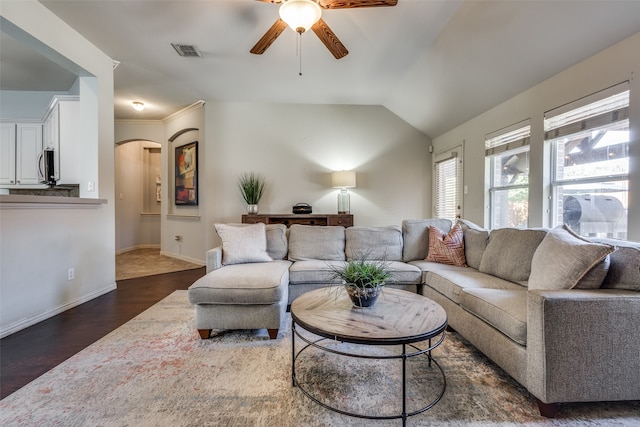 living room with lofted ceiling, dark hardwood / wood-style floors, and ceiling fan