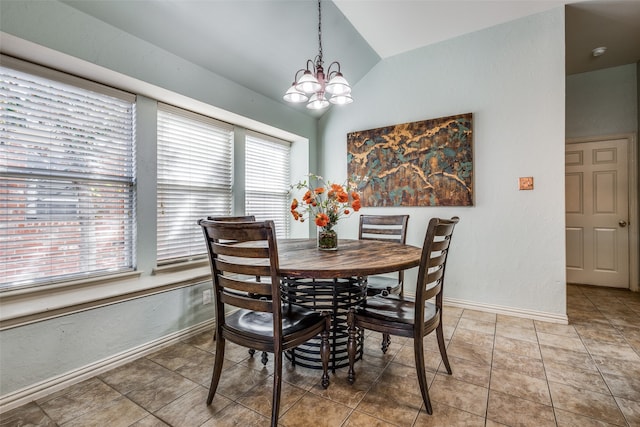 dining room with lofted ceiling, a chandelier, a healthy amount of sunlight, and tile patterned floors