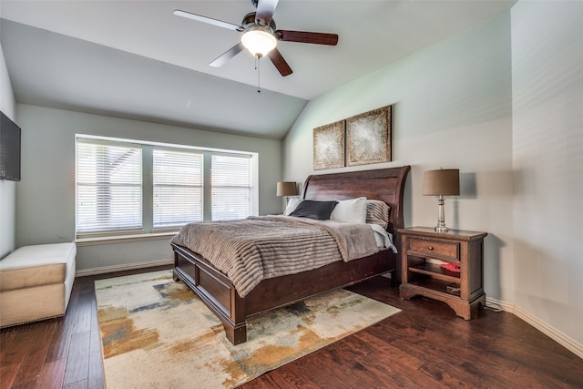 bedroom with dark wood-type flooring, ceiling fan, and vaulted ceiling