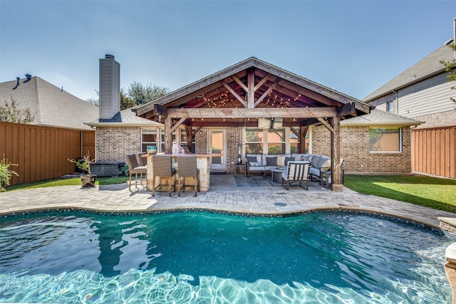 view of swimming pool with a gazebo, a patio area, and an outdoor hangout area