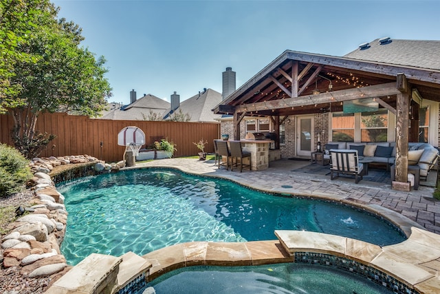 view of swimming pool with a gazebo, a patio area, a bar, and an in ground hot tub