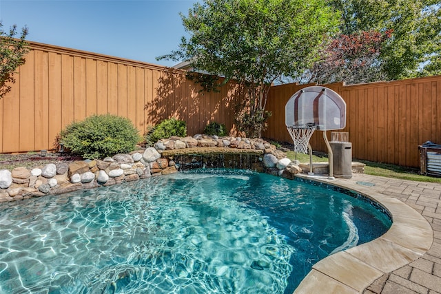 view of swimming pool featuring pool water feature