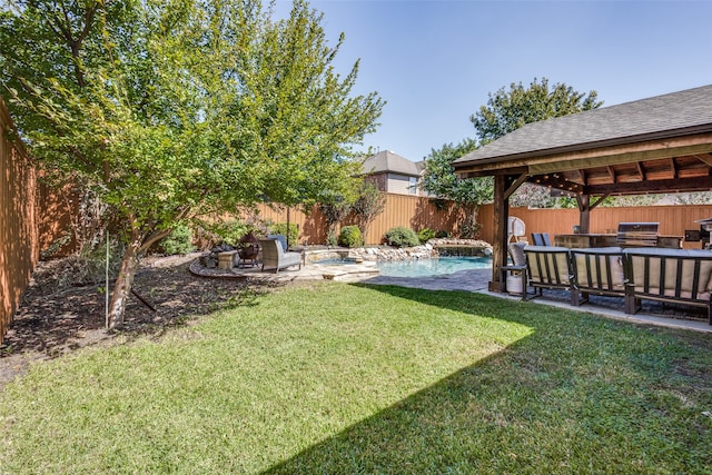 view of yard with a gazebo and a fenced in pool