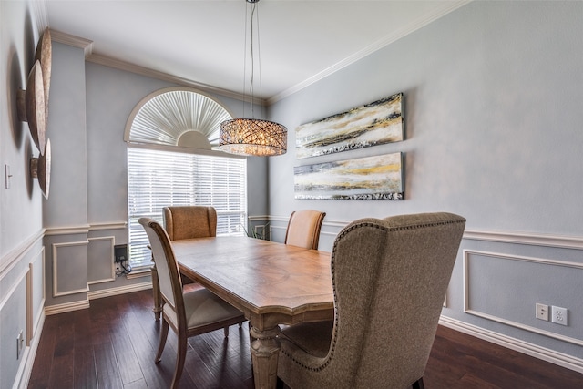 dining area featuring ornamental molding and dark wood-type flooring