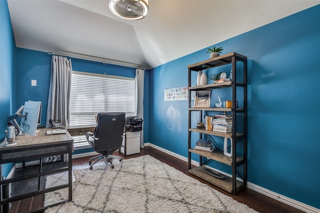 office space with vaulted ceiling and dark hardwood / wood-style flooring