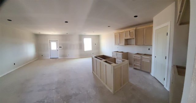 kitchen featuring light brown cabinetry and a center island