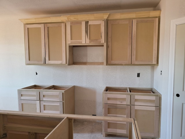 kitchen featuring light brown cabinetry