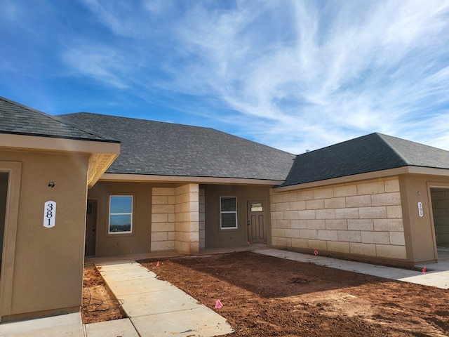 doorway to property featuring a garage