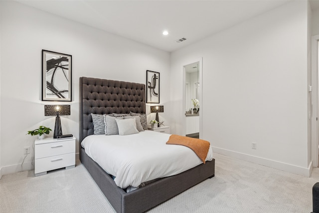 bedroom featuring light carpet