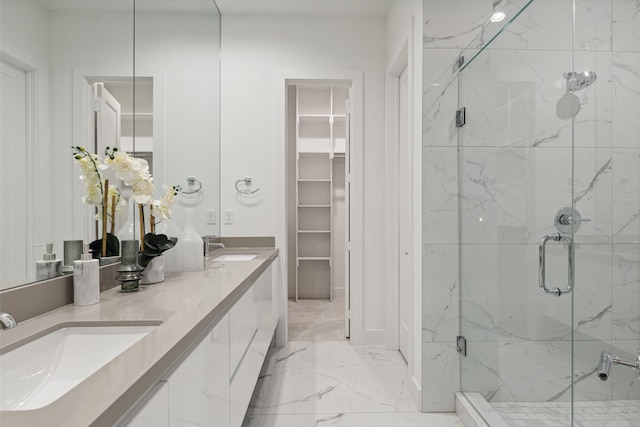 bathroom with vanity and a shower with shower door