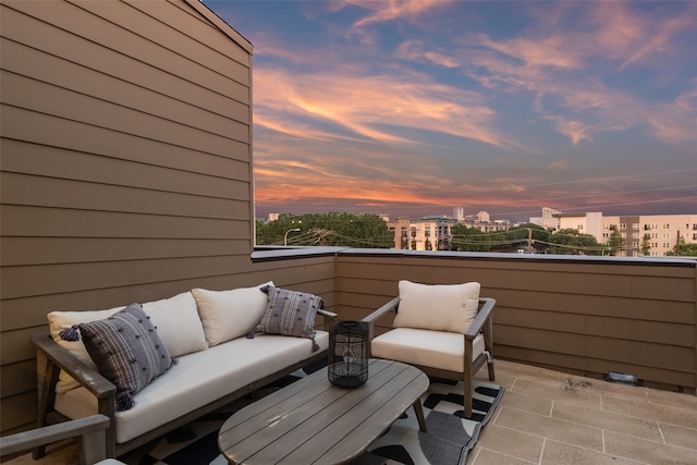 patio terrace at dusk with a balcony