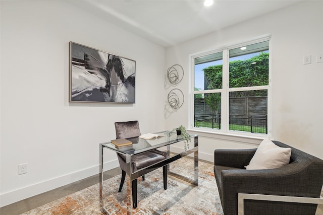 office space with concrete flooring