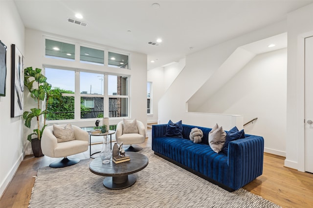 living room with light hardwood / wood-style flooring