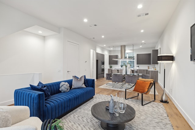 living room with light hardwood / wood-style flooring