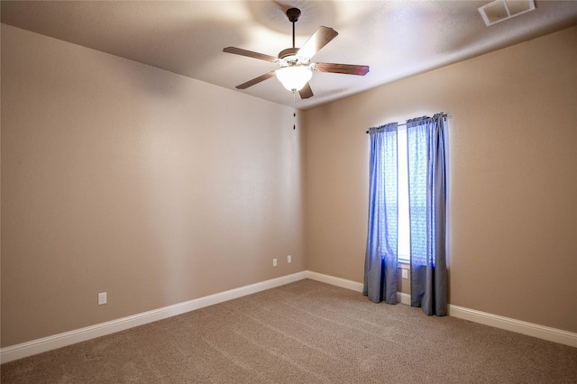 unfurnished room with carpet and ceiling fan