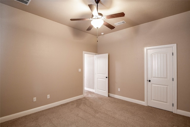 unfurnished room featuring ceiling fan and light colored carpet