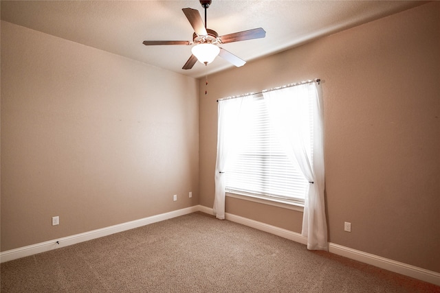 carpeted empty room with ceiling fan