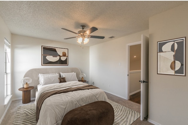 unfurnished bedroom with carpet, a closet, and ceiling fan