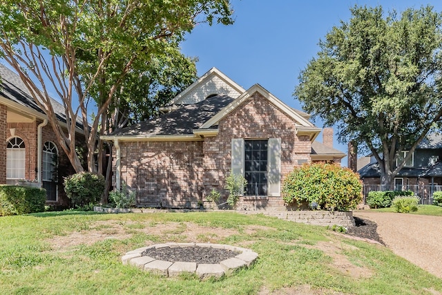 view of front of property featuring a garage and a front lawn