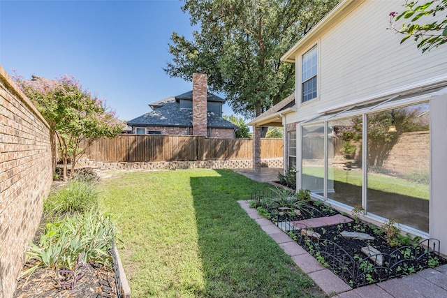 view of yard featuring a sunroom