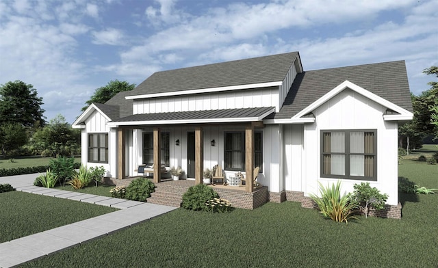 view of front of house with covered porch and a front yard