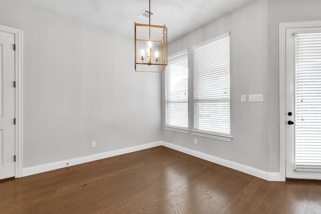 empty room with dark hardwood / wood-style floors