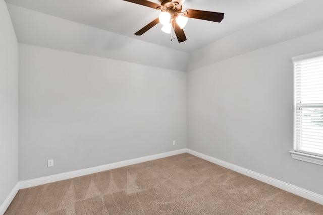 spare room with ceiling fan and light colored carpet