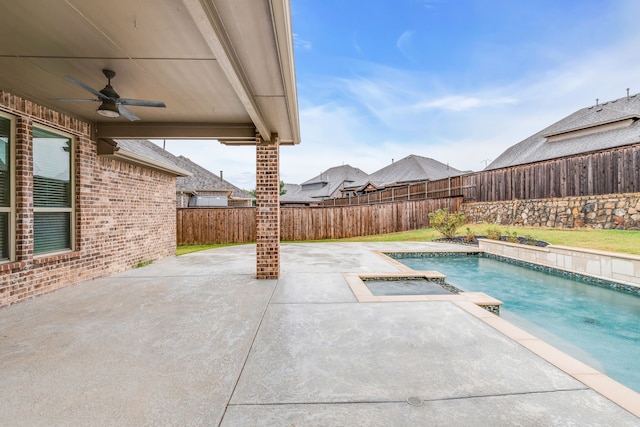 view of swimming pool with a jacuzzi, ceiling fan, and a patio area