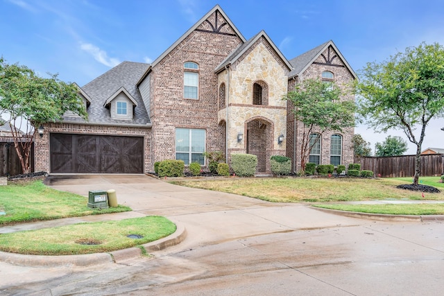 view of front of house with a front lawn and a garage