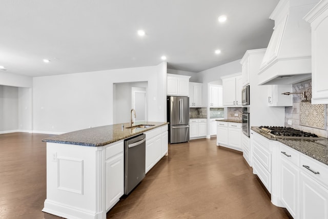 kitchen featuring white cabinets, sink, a center island with sink, stainless steel appliances, and dark hardwood / wood-style floors