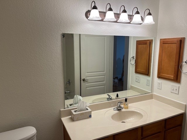 bathroom with vanity and toilet