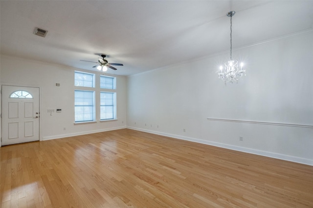 interior space with ornamental molding, ceiling fan with notable chandelier, and light hardwood / wood-style flooring