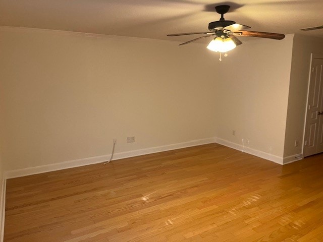 unfurnished room with ceiling fan and light hardwood / wood-style floors