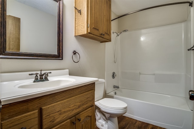 full bathroom with vanity, toilet, shower / bath combination, a textured ceiling, and hardwood / wood-style floors