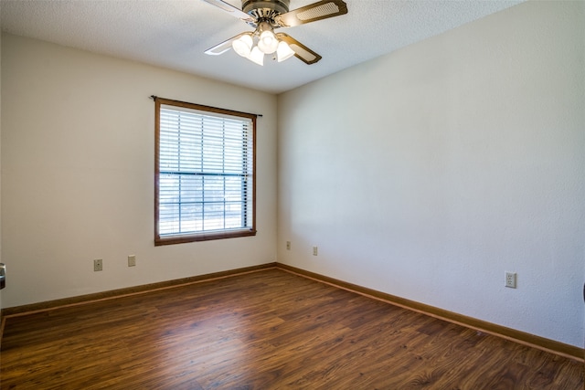 unfurnished room featuring ceiling fan, dark wood-type flooring, and a textured ceiling