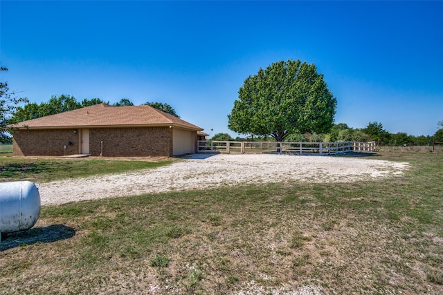 view of yard with a rural view