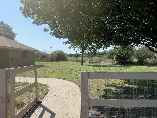 view of yard with a rural view