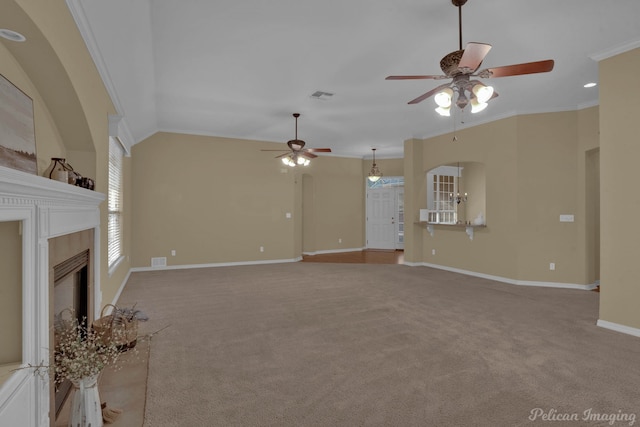 unfurnished living room with ceiling fan, light carpet, ornamental molding, and lofted ceiling