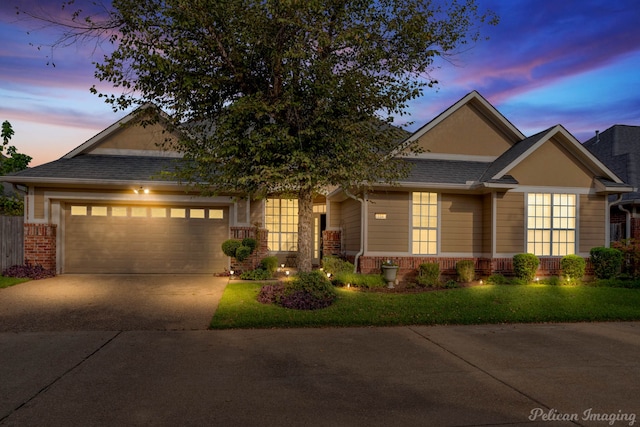 view of front of property with a garage