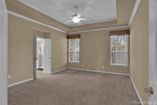 empty room featuring ceiling fan, a healthy amount of sunlight, and light colored carpet