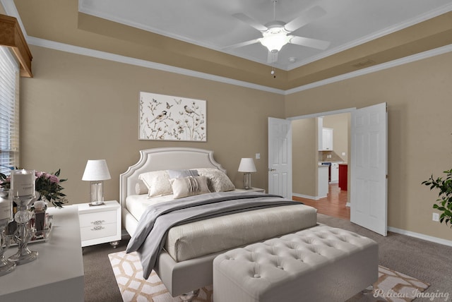 carpeted bedroom featuring ceiling fan and ornamental molding