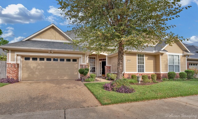 craftsman-style house featuring a front lawn and a garage