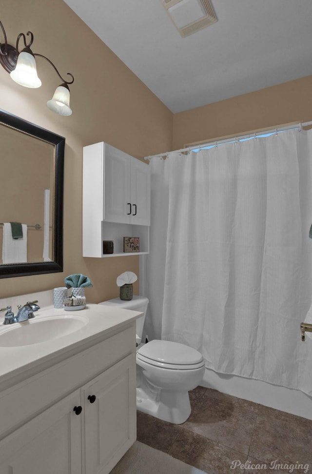 bathroom with vanity, a shower with curtain, toilet, and tile patterned floors