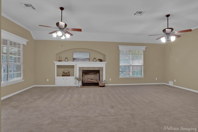 unfurnished living room with crown molding, light carpet, lofted ceiling, and ceiling fan