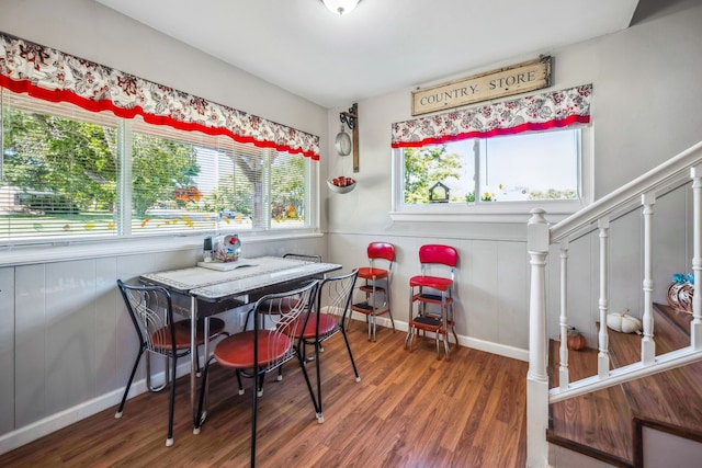 dining area with dark hardwood / wood-style flooring