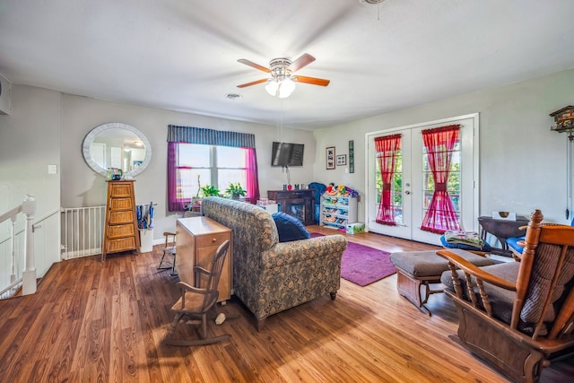 living room featuring french doors, ceiling fan, and hardwood / wood-style floors