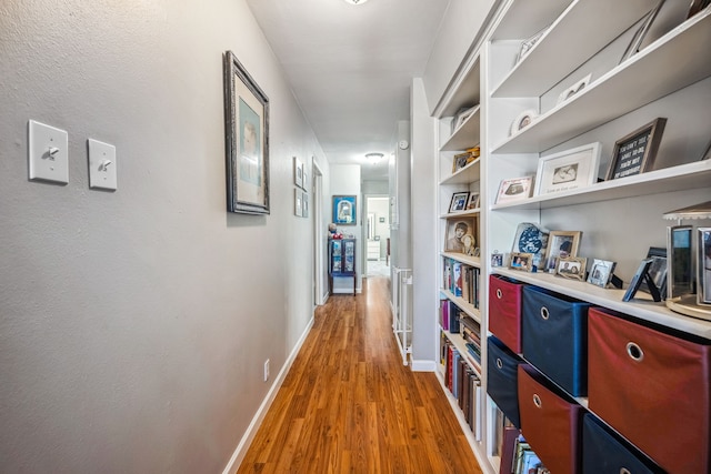 hall with wood-type flooring