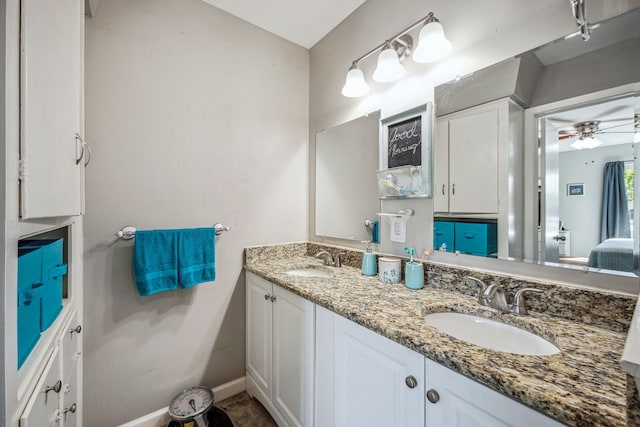 bathroom with ceiling fan and vanity